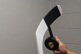 black hockey tape wrapping a white hockey stick